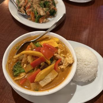 The Coconut On T - Mango red curry chicken (foreground) + basil fried rice - Thai Near Me - Sacramento, California The Coconut On T - Mango red curry chicken (foreground) + basil fried rice - Thai Near Me - Sacramento, California