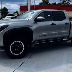 Toyota Rent a Car of Houston - The 2025 Toyota Tacoma: powerful hybrid engine, rugged design, advanced tech, and off-road ready. Perfect for adventure and daily driving!