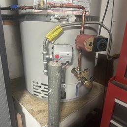 Water heater hot water pump timer and manifold