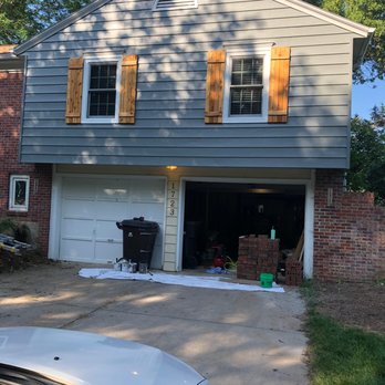 Affordable Home Improvement - a garage with shutters open - Painters Near Me Affordable Home Improvement - a garage with shutters open - Painters Near Me