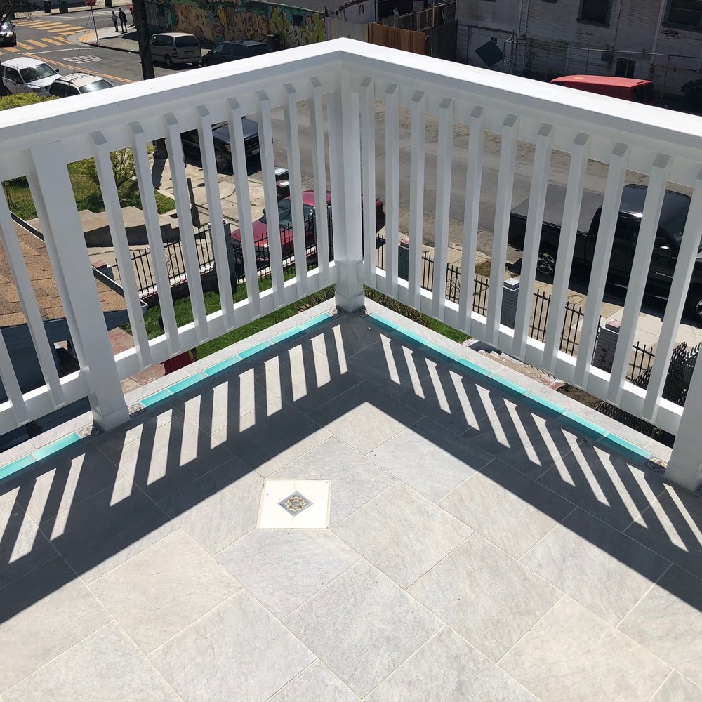 Millers Builders - a balcony with a view of a parking lot - Fences & Gates Near Me