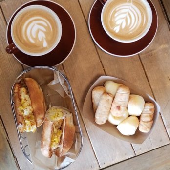 Macondo Coffee Roasters - Latte Coffee Egg and Cheese Sandwich with extra ham Venezuelan Tequeños X 2 Pan De Bono x 2 - Coffee & Tea Near Me - Doral, Florida Macondo Coffee Roasters - Latte Coffee Egg and Cheese Sandwich with extra ham Venezuelan Tequeños X 2 Pan De Bono x 2 - Coffee & Tea Near Me - Doral, Florida