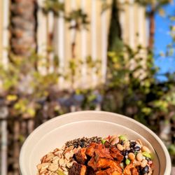 Smoked Tofu Bowl with cilantro lime rice, signature bbq sauce, charred corn relish, crispy quinoa, pickled vegetables, cowboy caviar, smoked