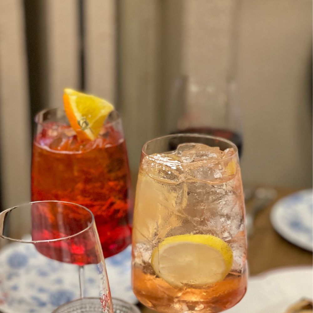 Sfoglina - Downtown - two glasses of wine and a plate of food - Italian Near Me - Washington, DC, District of Columbia Sfoglina - Downtown - two glasses of wine and a plate of food - Italian Near Me - Washington, DC, District of Columbia