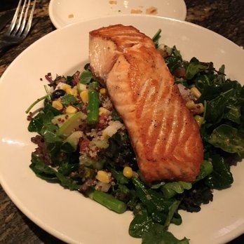 BJ's Restaurant & Brewhouse - Kale vegetable salad with grilled salmon - Pizza Near Me - Austin, Texas