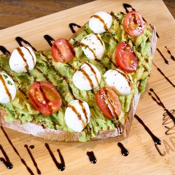 Carmela Coffee - Wellington - Caprese Avocado Toast at Carmela Coffee Wellington with artisan bread, avocado, mozzarella pearls, grape tomatoes, and balsam... - Coffee & Tea Near Me - Wellington, Florida Carmela Coffee - Wellington - Caprese Avocado Toast at Carmela Coffee Wellington with artisan bread, avocado, mozzarella pearls, grape tomatoes, and balsam... - Coffee & Tea Near Me - Wellington, Florida