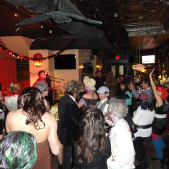 L.I.C. Bar - Costumed partiers listen to the crooning of Jerry Seinfeld - Bars Near Me - Long Island City, New York
