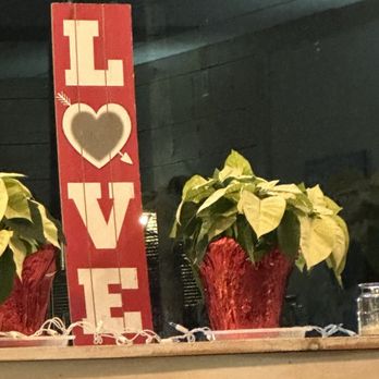 Caffeine's Midtown - two potted plants on a window sill - American Near Me - West Springfield, Massachusetts