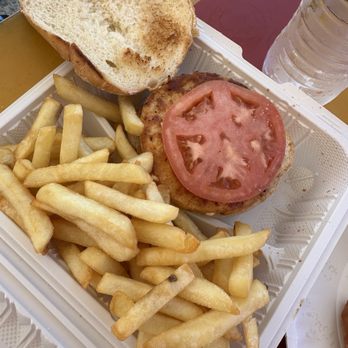 The Roti King - Salmon burger with fries - Caribbean Near Me - Saint John, Virgin Islands