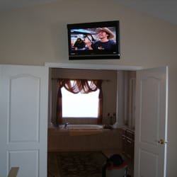 Simplified AV - 32" LCD over bathroom doorway in bedroom