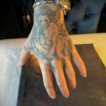 The Naughty Angel - Our waitresses beautiful tattoo. I've always had a thing for cherubs. - French Near Me - Las Vegas, Nevada