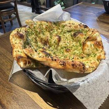 Tikka Indian Cuisine - Chili naan. Best naan I have had. Definitely spicy - Indian Near Me - Sarasota, Florida Tikka Indian Cuisine - Chili naan. Best naan I have had. Definitely spicy - Indian Near Me - Sarasota, Florida