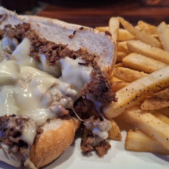 Miller's Ale House - Philly Cheesesteak with fries - Sports Bars Near Me - Pensacola, Florida
