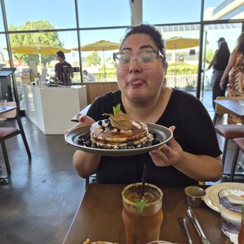Poached Kitchen - Me being silly with blue berry pancakes covered in chocolate sauce and topped with a mocha whipped butter - Breakfast & Brunch Near Me - Whittier, California Poached Kitchen - Me being silly with blue berry pancakes covered in chocolate sauce and topped with a mocha whipped butter - Breakfast & Brunch Near Me - Whittier, California