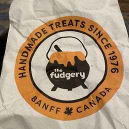 a paper bag with a logo on it a paper bag with a logo on it