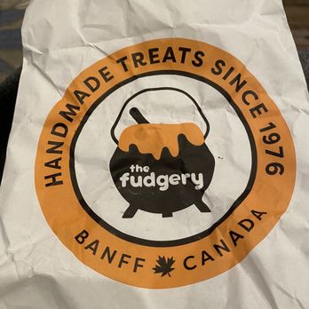 The Fudgery - a paper bag with a logo on it - Candy Stores Near Me - Banff, Alberta The Fudgery - a paper bag with a logo on it - Candy Stores Near Me - Banff, Alberta