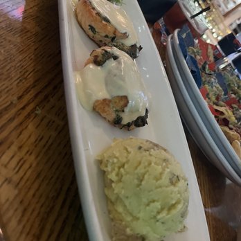 Rick's Café Boatyard - Atlantic Salmon Roulades Rolled in spinach and Boursin cheese. Fired in our wood oven. With Mornay sauce and Yukon gold mashed potatoes. - American Near Me - Indianapolis, Indiana Rick's Café Boatyard - Atlantic Salmon Roulades Rolled in spinach and Boursin cheese. Fired in our wood oven. With Mornay sauce and Yukon gold mashed potatoes. - American Near Me - Indianapolis, Indiana