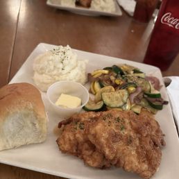 Southern fried chicken with a hot honey glaze, mashed potatoes, vegetable medley, and a homemade roll Southern fried chicken with a hot honey glaze, mashed potatoes, vegetable medley, and a homemade roll