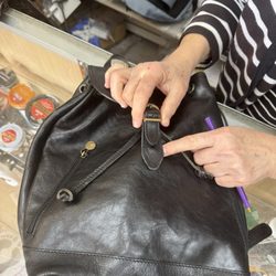 Monrovia Shoe Repair - Backpack with new leather piece and buckle.