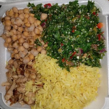 The Green Chicpea - A platter with rotisserie chicken, rice, hot chickpeas and tabulei. - Middle Eastern Near Me - Newark, New Jersey
