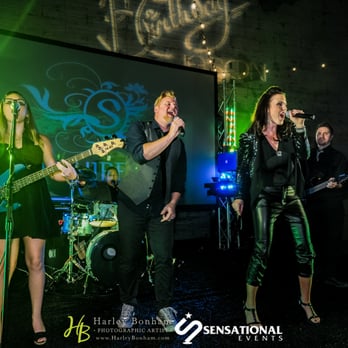 Sapphire Sky - a group of people singing on stage - Music Venues Near Me Sapphire Sky - a group of people singing on stage - Music Venues Near Me