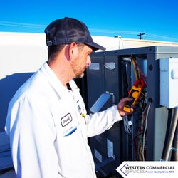 Western Commercial Services - Our Refrigeration tech working on the roof of a client.