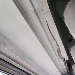 Stillman Management - The wall above the window is breaking apart. Management stated that it needs to be paid for out of pocket!