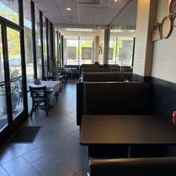 Lots of booth seating indoors. And outdoor picnic tables too