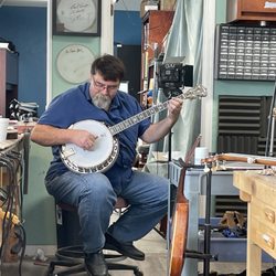 Acoustic Box Banjo Repair Specialist - Owner Ritchie Dotson setting up a Deering White Lotus
