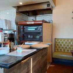 Padrino’s - Big pizza oven (and cool pizza peel with the guitar neck for a handle)