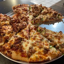 Vernie's Pizza - Large half and half specialty pizza. Half all meat, half Supreme.