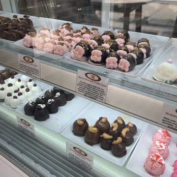 Ruby's Chocolates - Assorted truffle chocolates with different designs and flavors are arranged in a display case at Ruby's Chocolates in Cincinnati, OH. - Chocolatiers & Shops Near Me - Cincinnati, Ohio