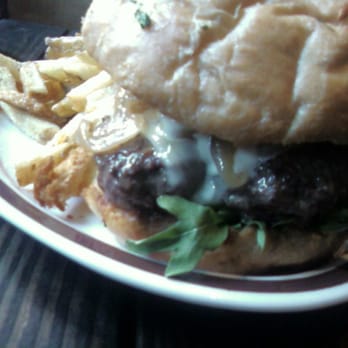 Kings Row Gastropub - Dry Aged Burger. Very yummy. A little messy. Two types of cheese and a house-made bun. Onions grilled in duck fat. - Gastropubs Near Me - Pasadena, California