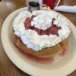 Belgium waffle with added strawberries & whip cream Belgium waffle with added strawberries & whip cream