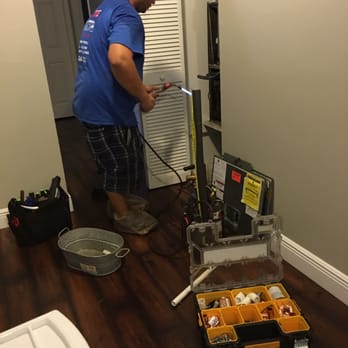 Prime Time Cooling - After the coils are cleaned, the technician is ready to put it back in place. - Heating & Air Conditioning/HVAC Near Me - Pompano Beach, Florida