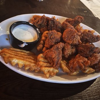 Henry's Tavern - Boneless Buffalo wings with waffle fries. AMAZING we bought some of their homemade sauce to take home. - New American Near Me - Denver, Colorado Henry's Tavern - Boneless Buffalo wings with waffle fries. AMAZING we bought some of their homemade sauce to take home. - New American Near Me - Denver, Colorado