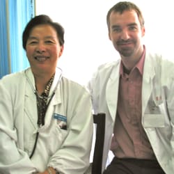 Asheville Acupuncturist James Whittle with Dr. Jiang seeing cardiology patients in Shanghai China, 2003