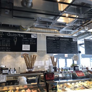 Tre Galli Gelato Caffe - a woman standing in front of the counter - Italian Near Me - Vancouver, British Columbia Tre Galli Gelato Caffe - a woman standing in front of the counter - Italian Near Me - Vancouver, British Columbia