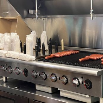 Puka Dog - Grilling the buns and dogs. - Hot Dogs Near Me - Koloa, Hawaii