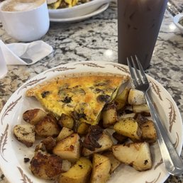 Mushroom and mozzarella quiche with roasted red potatoes.  Also, an iced butter pecan latte.  Everything was amazing!