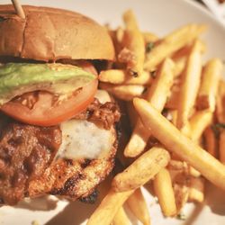 Karl Strauss Brewing Company - Mesquite Chicken. Smoky, cheesy, bacon-packed with avocado, lettuce, tomato & chili aioli. Fries included.