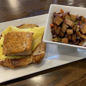 Gochas Breakfast Bar | Cascade - Salmon and egg on croissant with breakfast potatoes - Wine Bars Near Me - Atlanta, Georgia Gochas Breakfast Bar | Cascade - Salmon and egg on croissant with breakfast potatoes - Wine Bars Near Me - Atlanta, Georgia