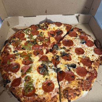 Sergio's Bakery and Cafe - Large pizza with pepperoni, mushroom, black olive, and green chile - Bakeries Near Me - Albuquerque, New Mexico