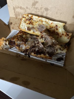 Photo of Domino's Pizza - Ashburn, VA, US. a half eaten pizza in a box