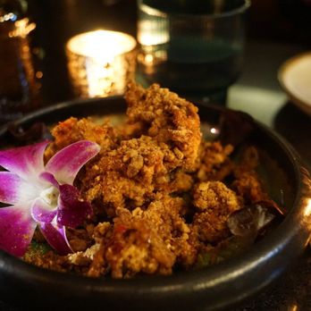 Valla Table - a bowl of food and a candle - Thai Near Me - New York, New York Valla Table - a bowl of food and a candle - Thai Near Me - New York, New York