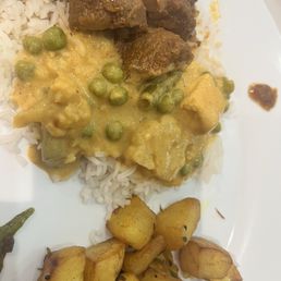 Goat curry, veggie curry and potatoes