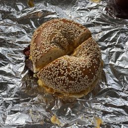 Pastrami egg and cheese on sesame seed bagel Pastrami egg and cheese on sesame seed bagel