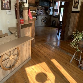 The Coffee Saloon - a wooden bar with a wheel on the counter - Coffee & Tea Near Me - Dos Palos, California