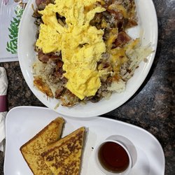 Carlos Pancake House - Egg skillet pick four, sausage , bacon, mushrooms, cheese . 3 scrambled eggs. French toast potatoes. Y