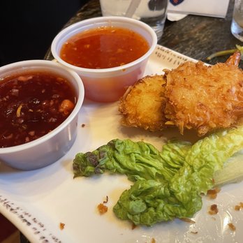 Donivan's Restaurant - Coconut shrimp appetizer. The darker sauce is plum recommended by our server. She was right about it being the better choice - American Near Me - Anaconda, Montana Donivan's Restaurant - Coconut shrimp appetizer. The darker sauce is plum recommended by our server. She was right about it being the better choice - American Near Me - Anaconda, Montana